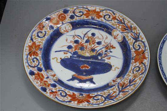 A Chinese Imari plate decorated with flowers in an urn, 25cm and a blue and white plate, 23cm